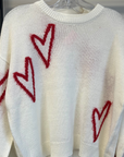 Cozy White Sweater with Red Heart Accents