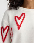Cozy White Sweater with Red Heart Accents